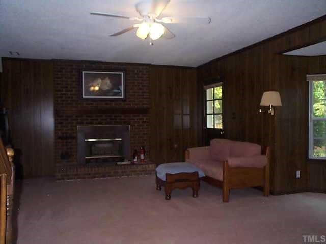 5412 Live Oak Trail Raleigh, NC 27613 - Photo 6 of 10 a living room with furniture and a fireplace