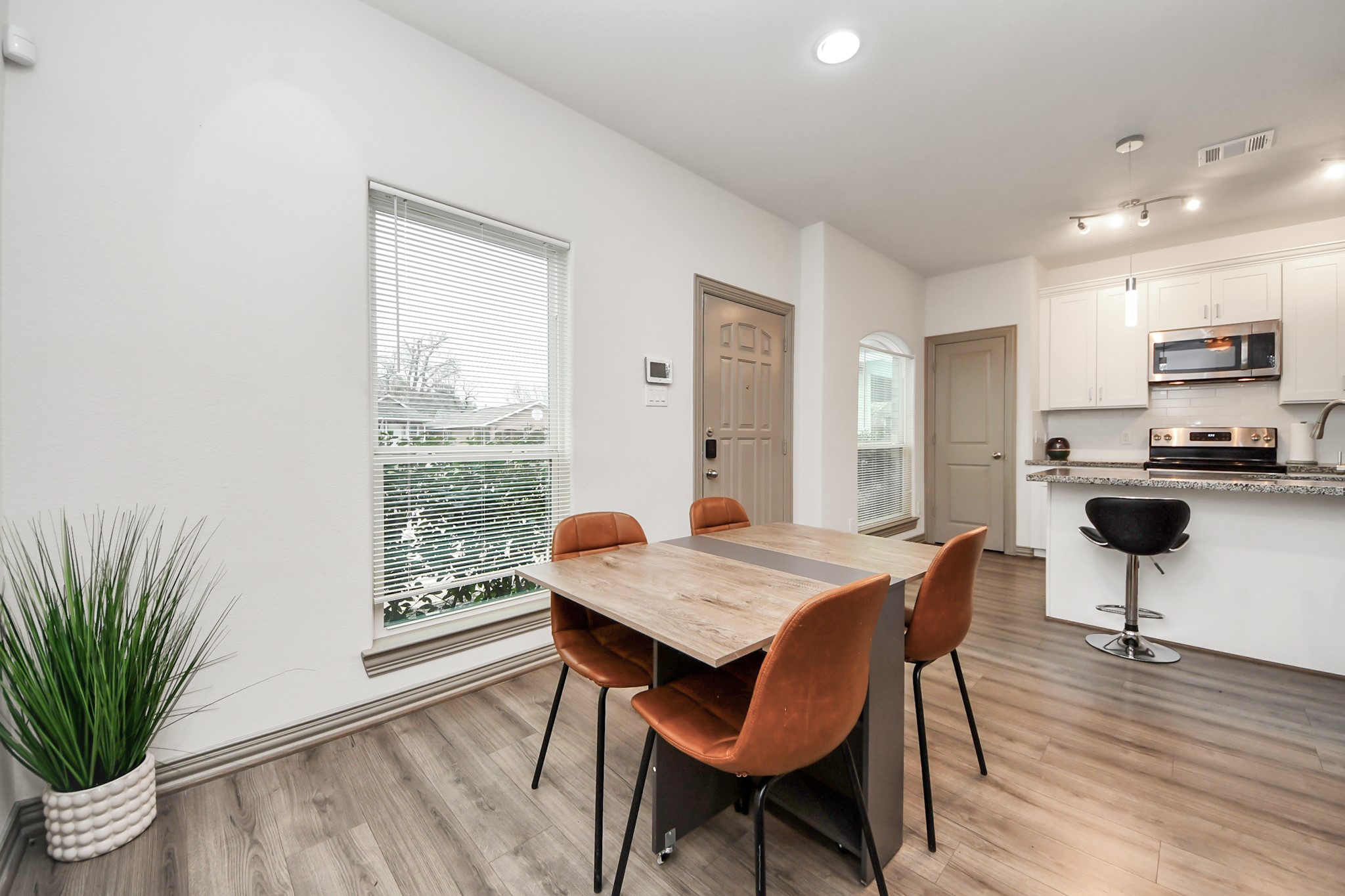 5334 Pershing Street Houston, TX 77033 - Photo 39 of 43 a view of a dining room with furniture and a wooden floor