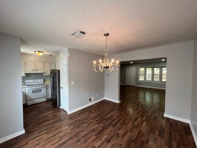 236 Chads Ford Way Roswell, GA 30076 - Photo 13 of 24 a view of a room with wooden floor kitchen and windows