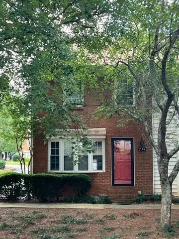 a front view of a house with yard