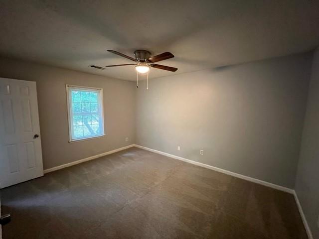 236 Chads Ford Way Roswell, GA 30076 - Photo 6 of 24 an empty room with windows and fan