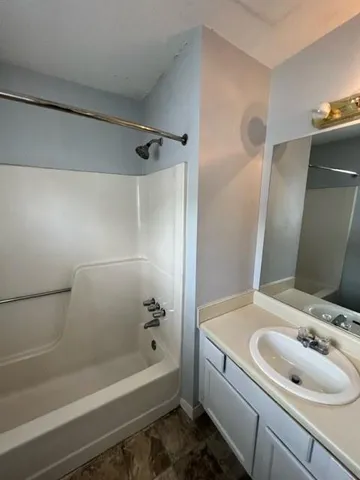 a bathroom with a sink and a bathtub