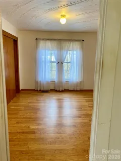 a view of a house with a street