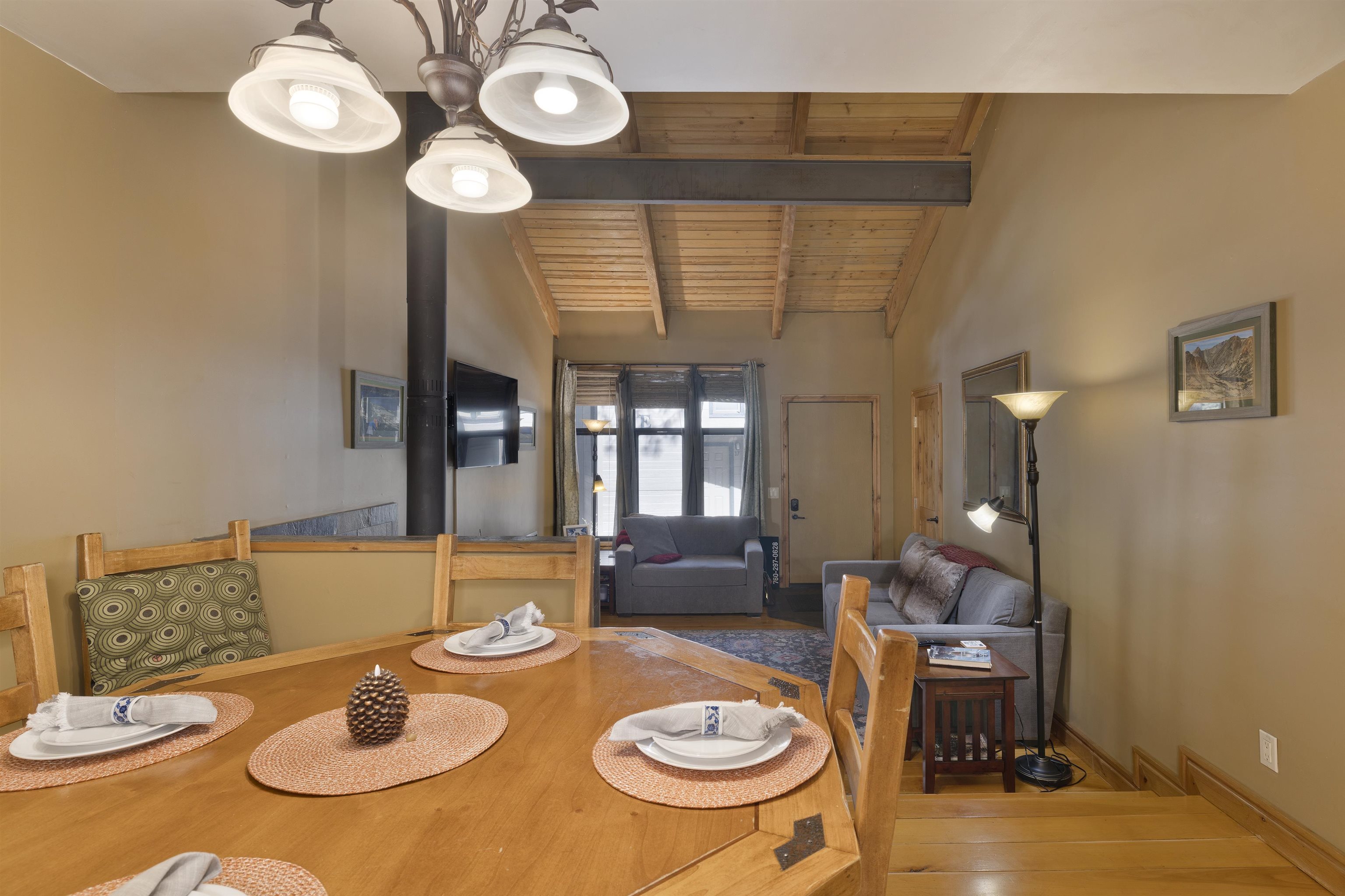 2252 Meridian Boulevard, Unit 32 Mammoth Lakes, CA 93546 - Photo 8 of 31 Dining room with lofted ceiling with beams, wooden ceiling, light wood-type flooring, and suspended lighting