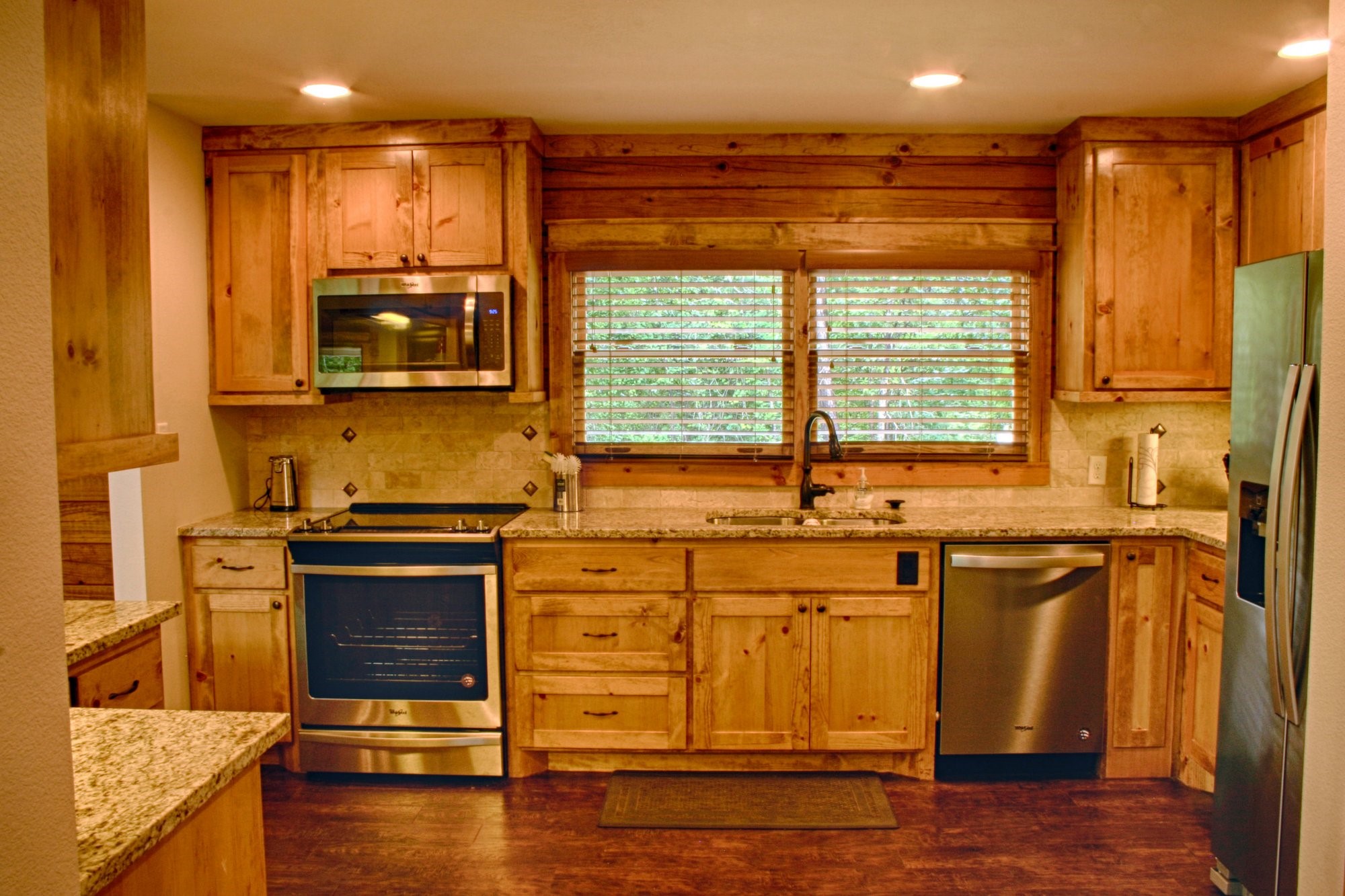 91 Bluejay Way Cleveland, TX 77327 - Photo 18 of 35 a kitchen with stainless steel appliances granite countertop a stove and a sink