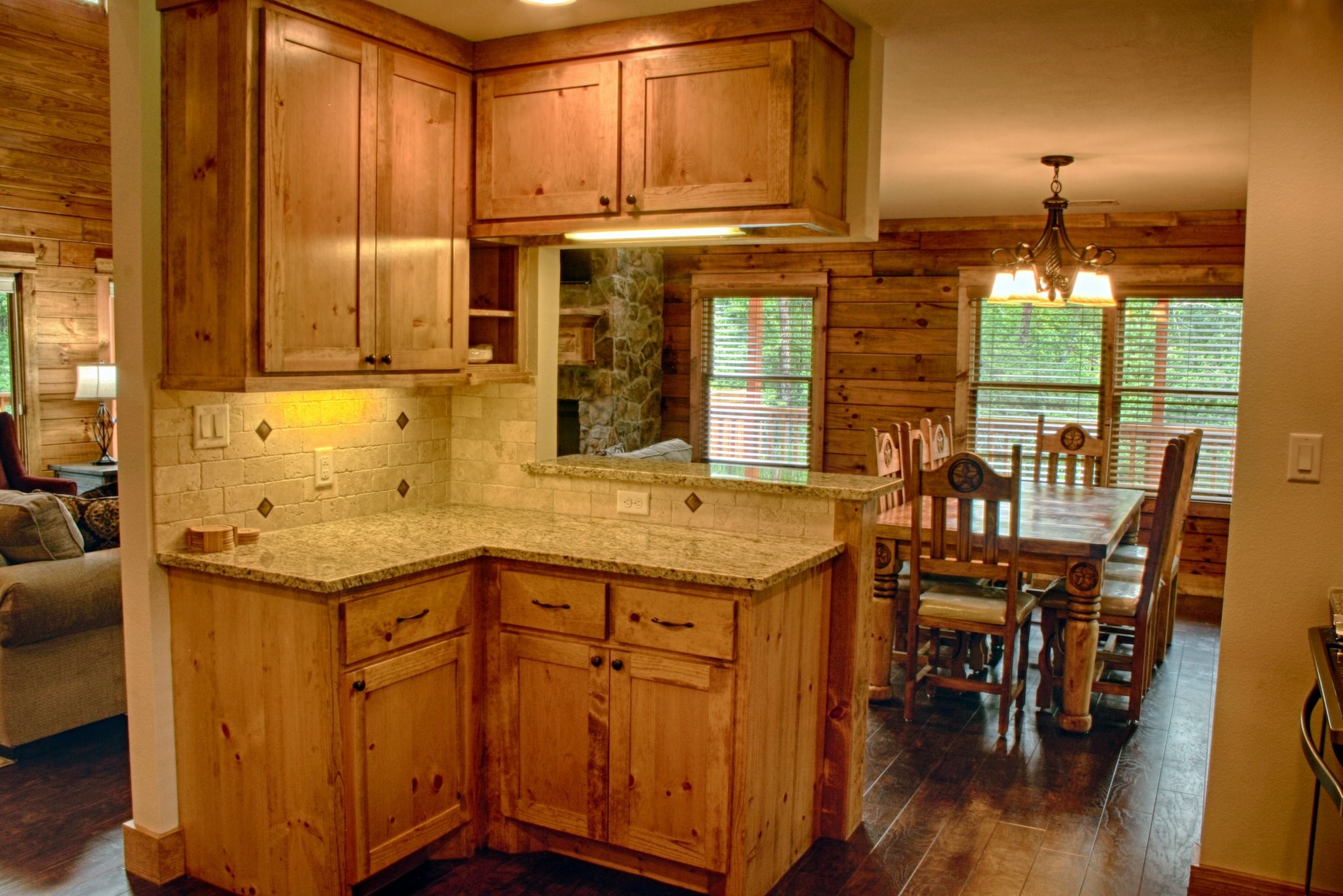 91 Bluejay Way Cleveland, TX 77327 - Photo 19 of 35 a kitchen with stainless steel appliances granite countertop a stove and a wooden cabinets