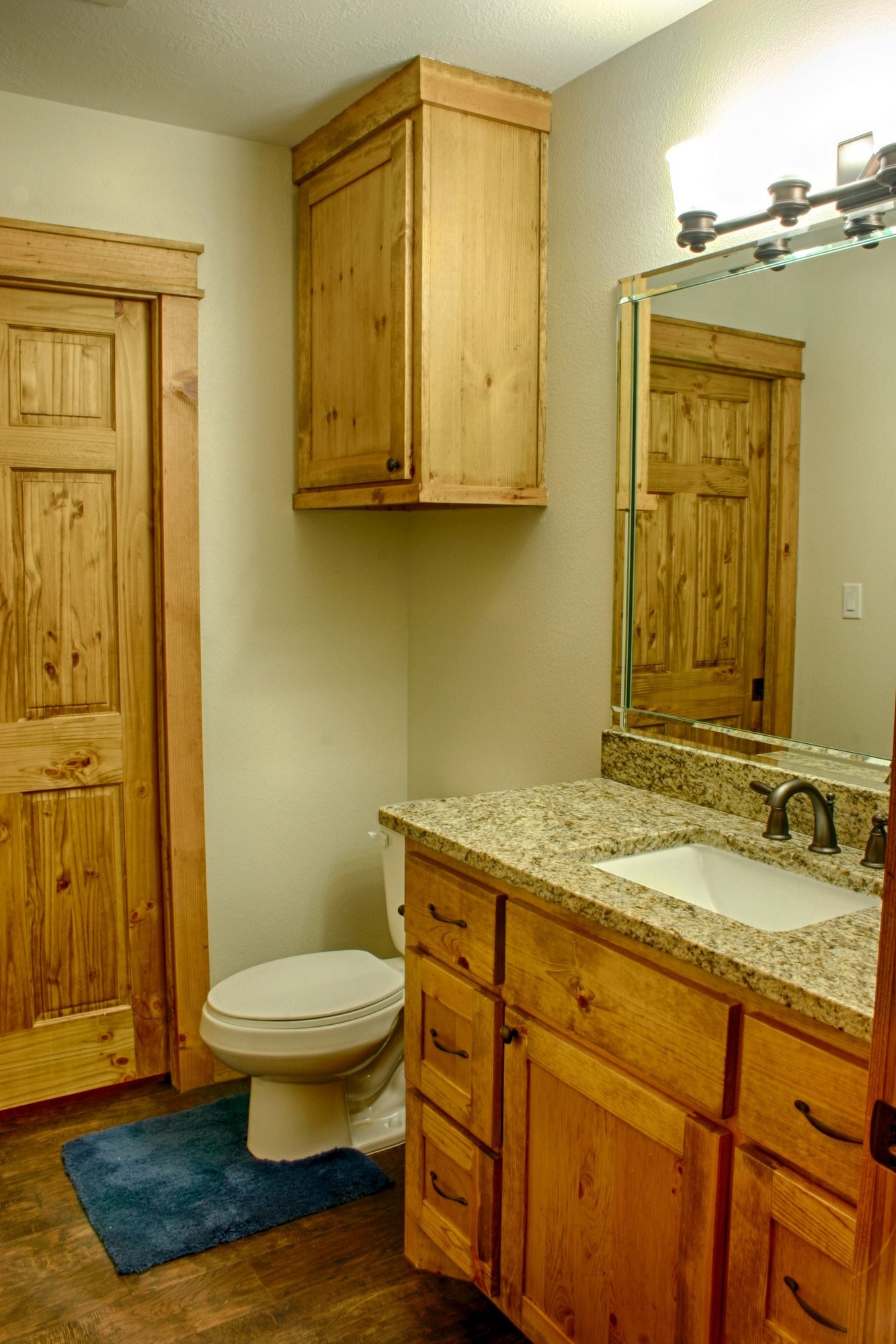 91 Bluejay Way Cleveland, TX 77327 - Photo 20 of 35 a bathroom with a granite countertop toilet sink and mirror