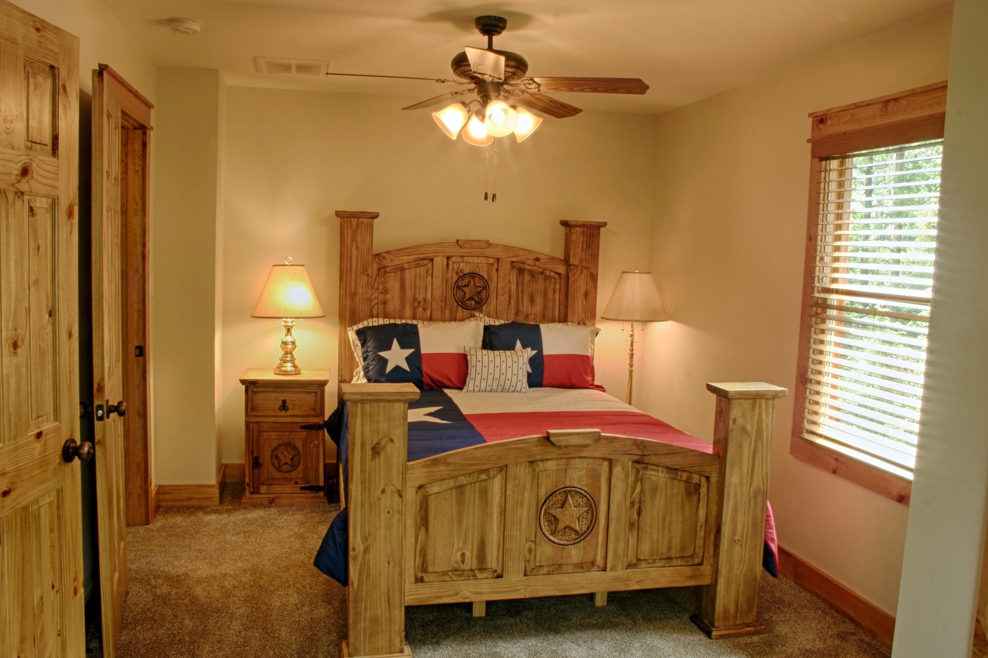 91 Bluejay Way Cleveland, TX 77327 - Photo 27 of 35 a bedroom with a bed and a chandelier