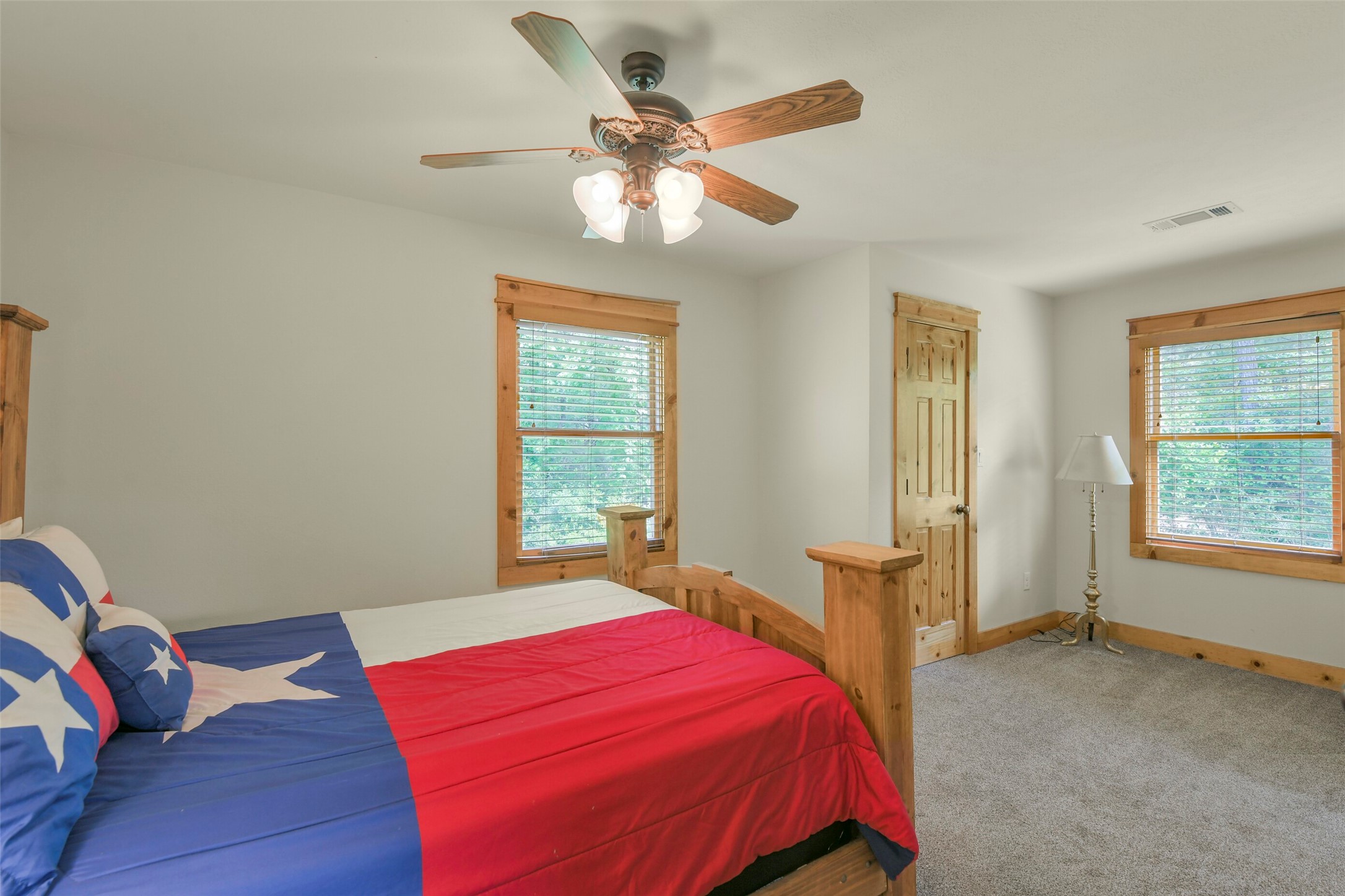 91 Bluejay Way Cleveland, TX 77327 - Photo 34 of 50 a bedroom with a large bed and a window