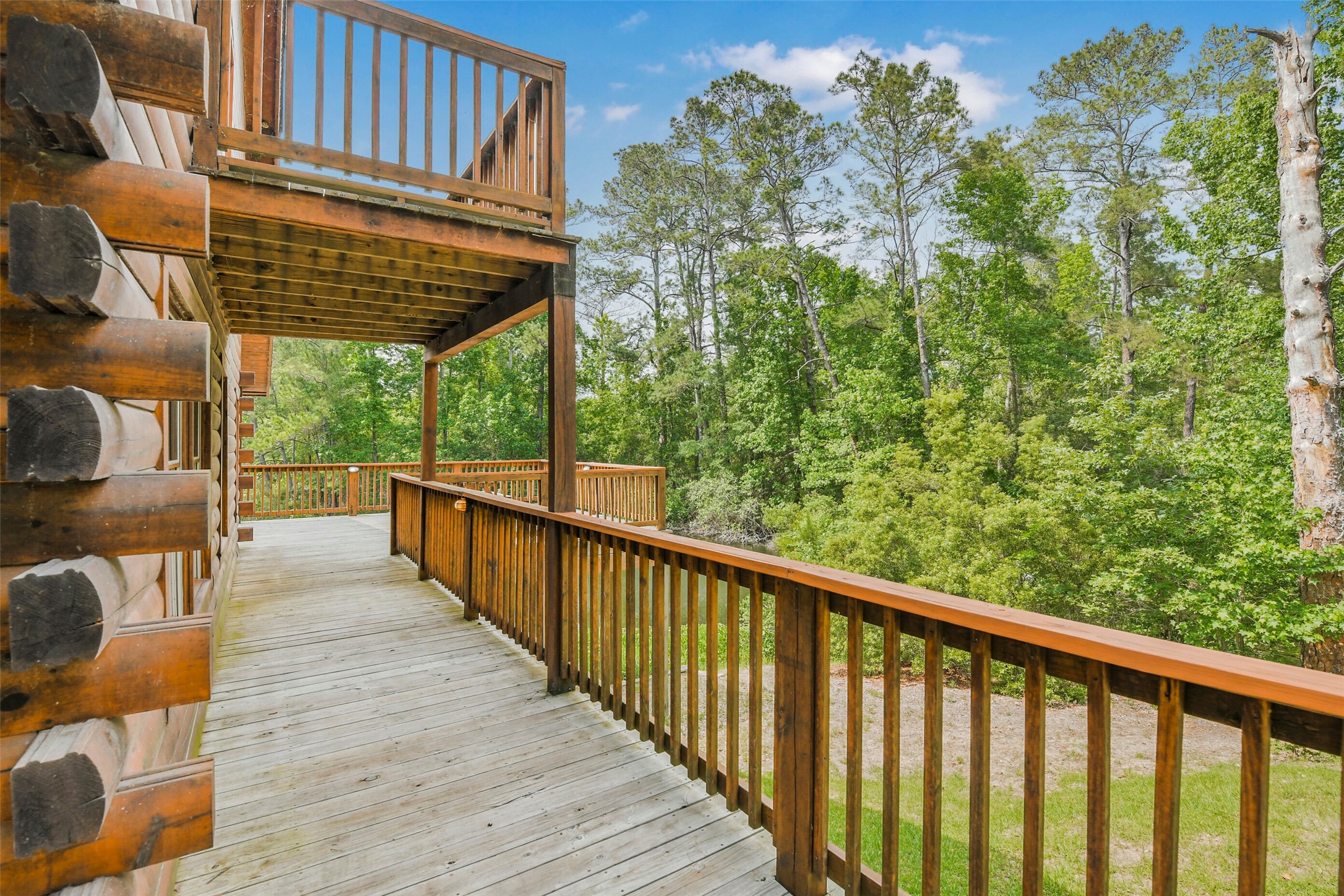 91 Bluejay Way Cleveland, TX 77327 - Photo 40 of 50 a view of a balcony with outdoor space