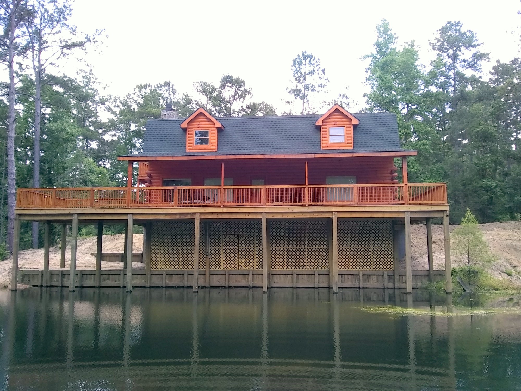 91 Bluejay Way Cleveland, TX 77327 - Photo 4 of 35 a view of a house with a lake from a balcony