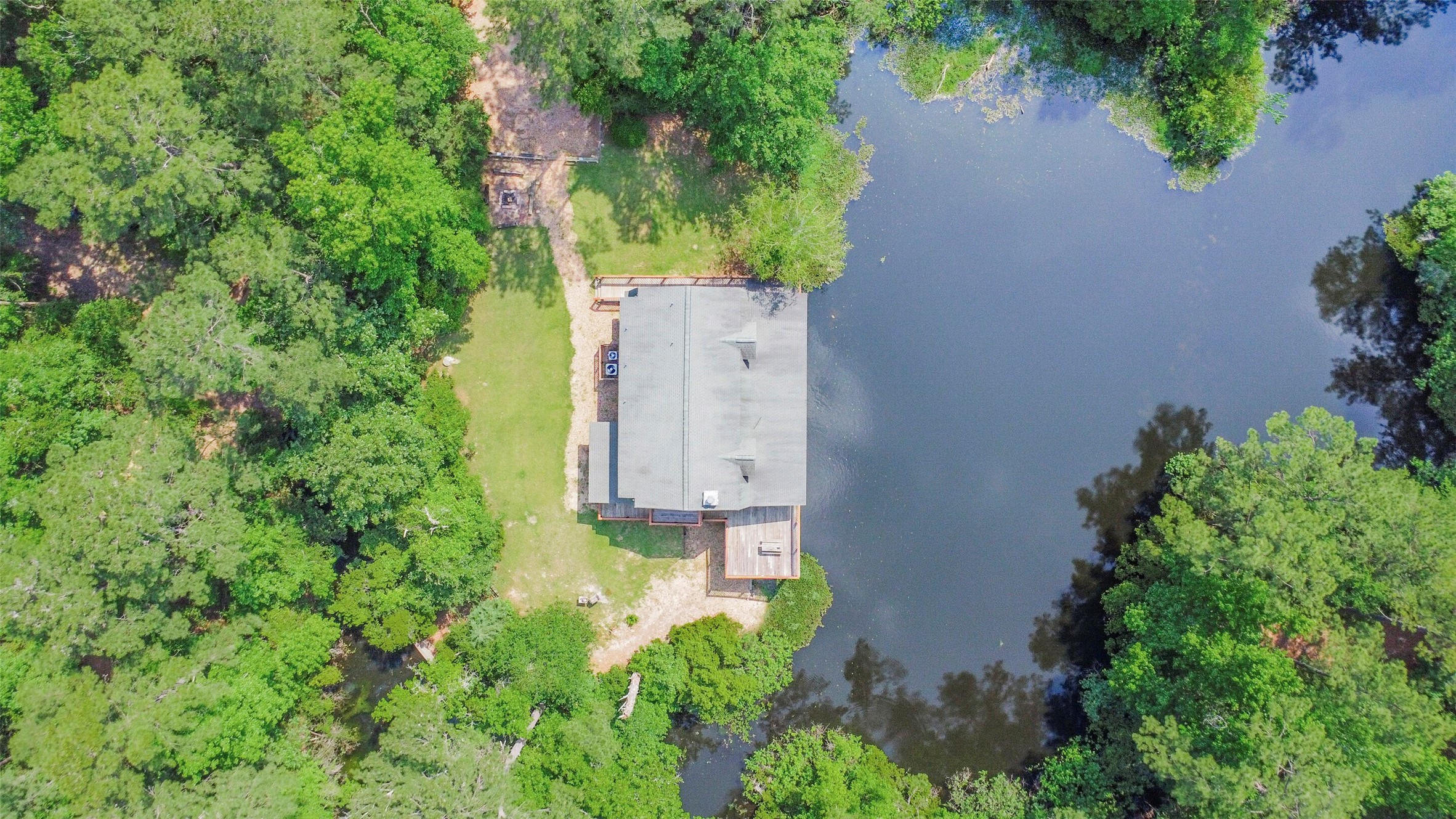 91 Bluejay Way Cleveland, TX 77327 - Photo 41 of 50 an aerial view of residential house with outdoor space and trees all around