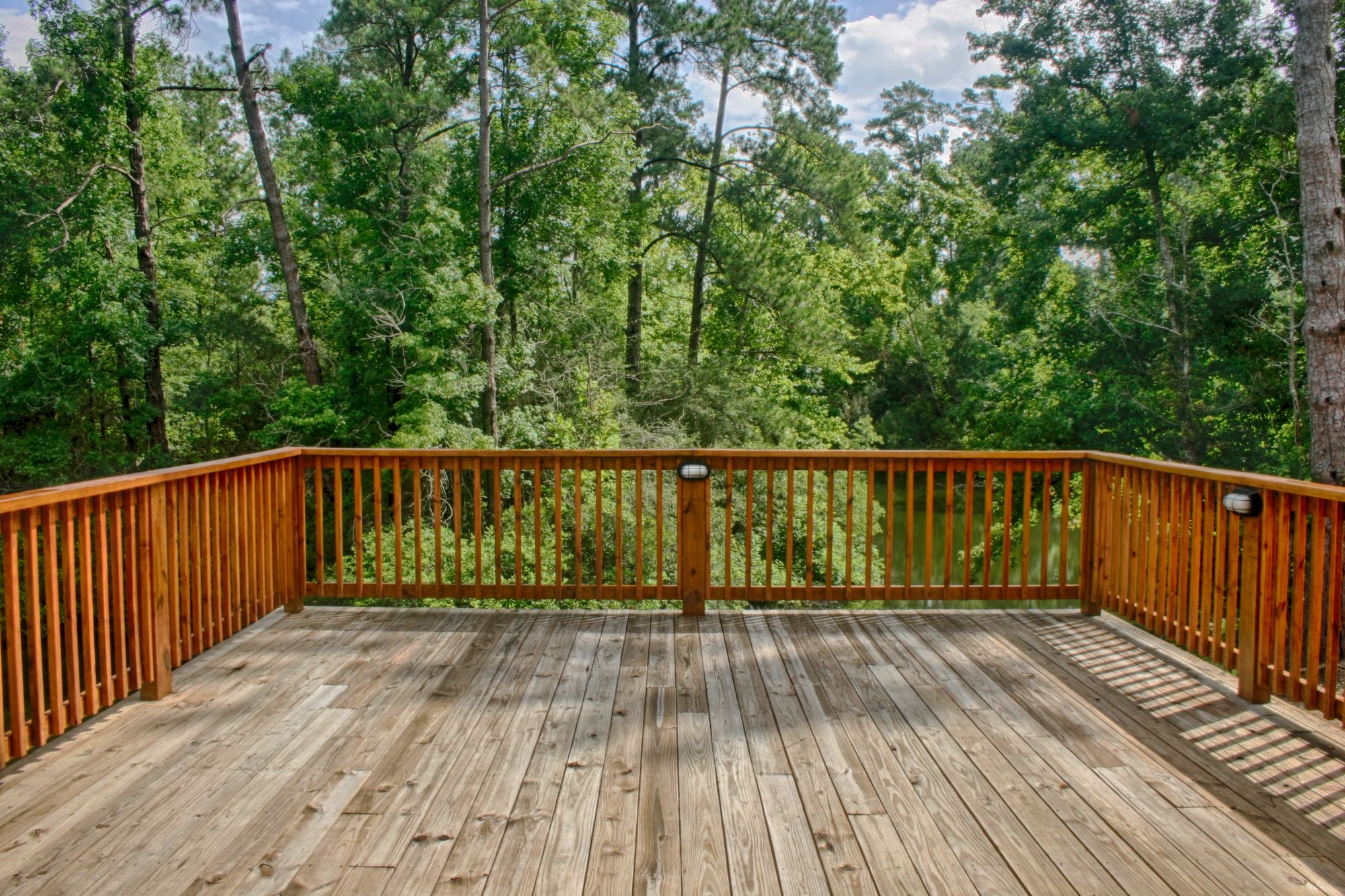 91 Bluejay Way Cleveland, TX 77327 - Photo 7 of 35 a view of balcony with wooden floor