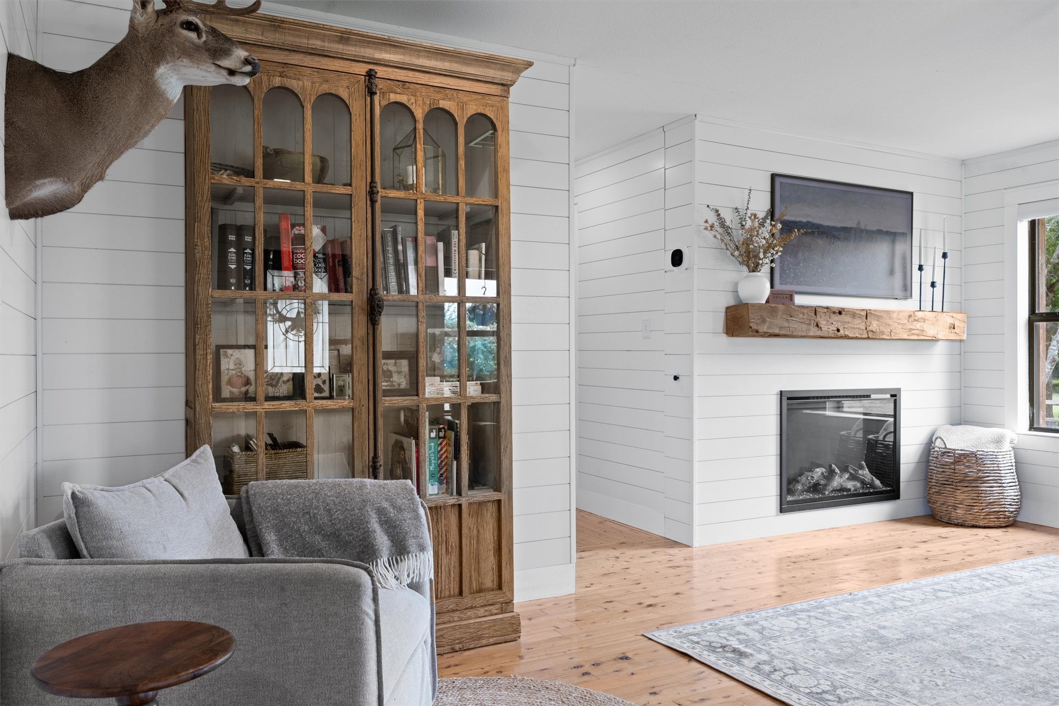 13590 Ranch Road 2338 Georgetown, TX 78633 - Photo 11 of 39 Partial view of family room. New fireplace, mantle and shiplap walls. Hallway leads to 2nd bathroom and 3 bedrooms.
