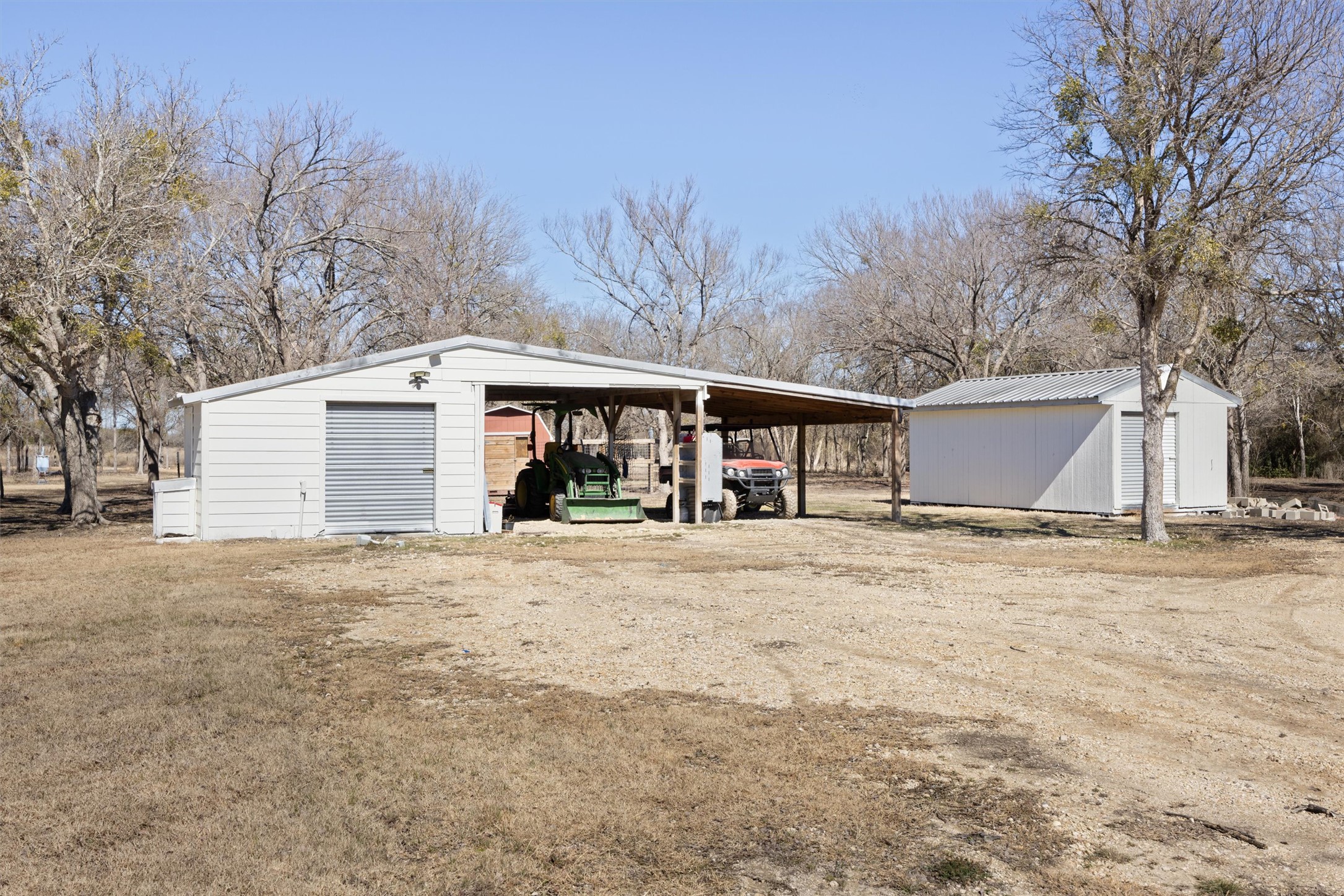 13590 Ranch Road 2338 Georgetown, TX 78633 - Photo 29 of 39 One of 4 outbuildings. This 24X25 workshop with covered parking area for boat/trailer-no electricity.