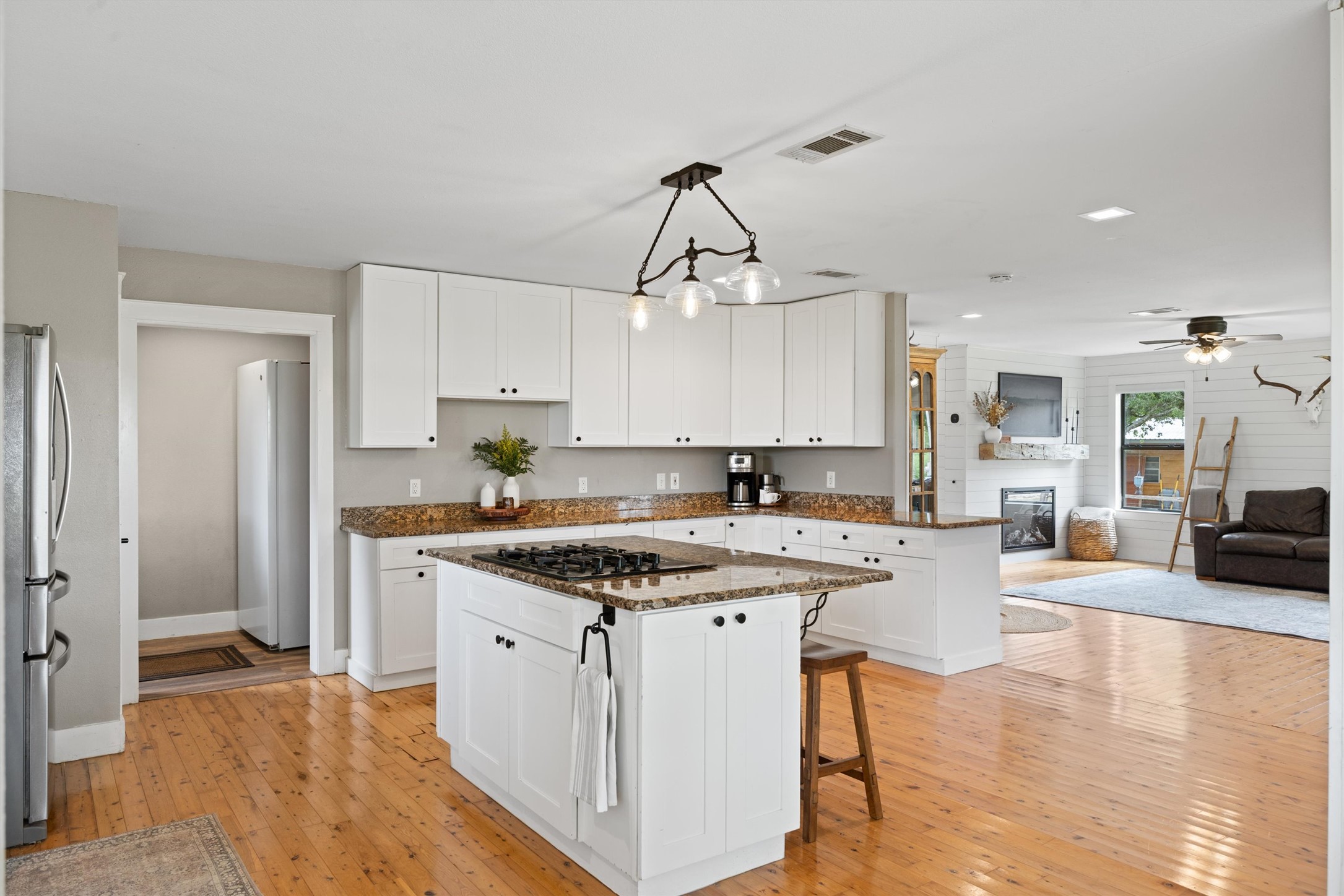 13590 Ranch Road 2338 Georgetown, TX 78633 - Photo 6 of 39 Overview of kitchen area, built in countertop gas cooktop on the island.