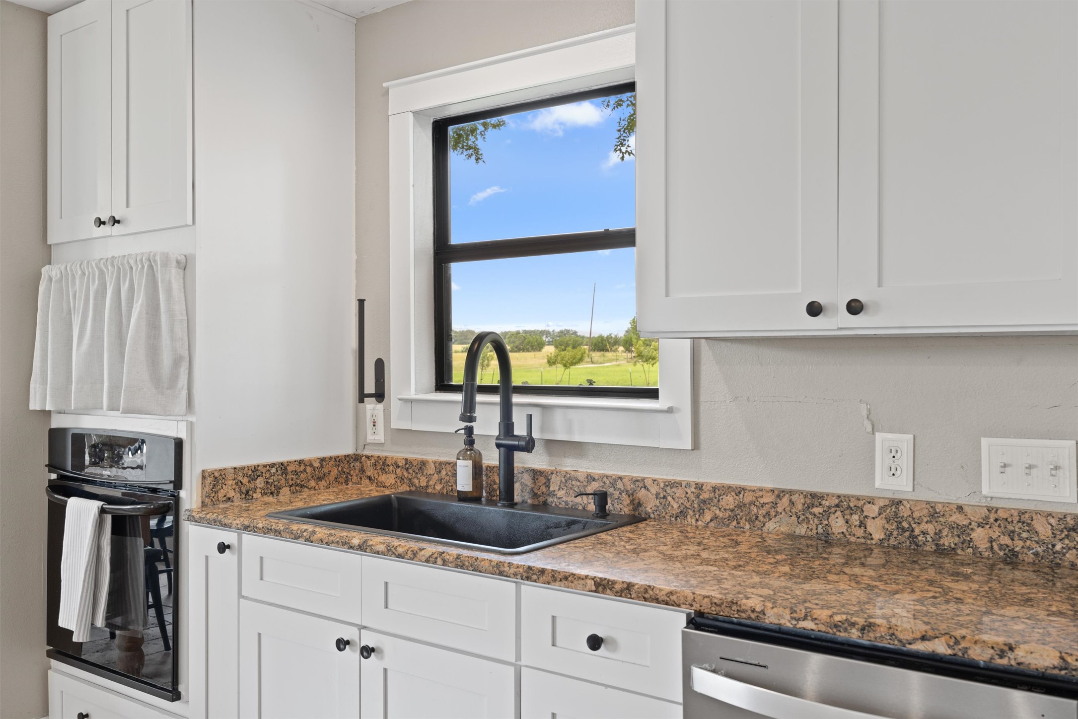 13590 Ranch Road 2338 Georgetown, TX 78633 - Photo 7 of 39 Granite counters in the kitchen, built in electric oven.