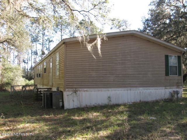 140 Oak Run Road Crescent City, FL 32112 - Photo 3 of 22 END & REAR VIEW OF HOME IMG_0024
