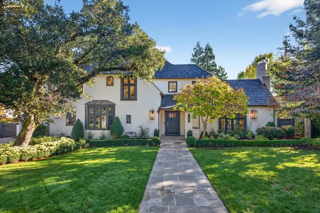 a front view of house with yard and green space