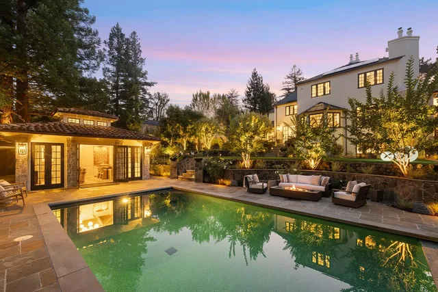 a view of a water fountain in front of the house