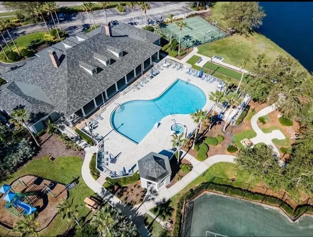 an aerial view of a house with a swimming pool