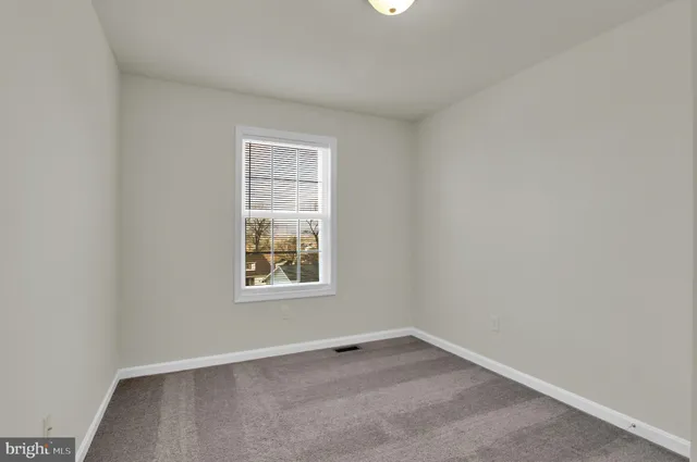 a bathroom with a sink toilet a mirror and shower