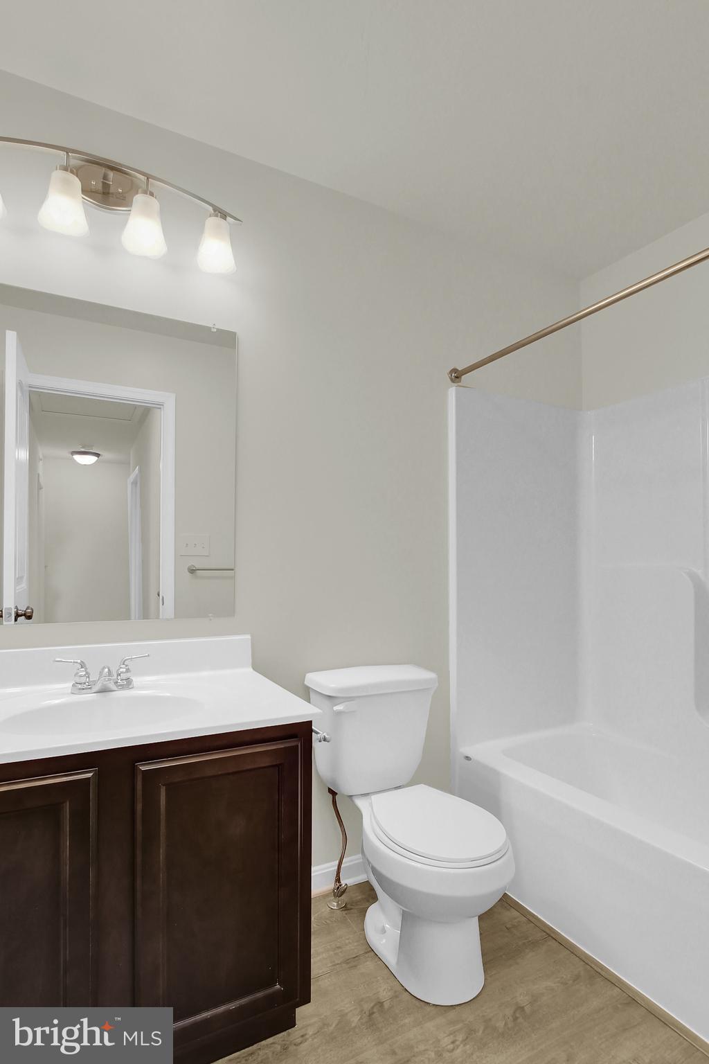 74 Brookside Avenue Hanover, PA 17331 - Photo 12 of 13 a bathroom with a sink toilet a mirror and shower