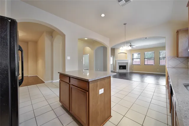 a view of a kitchen with a sink and cabinets