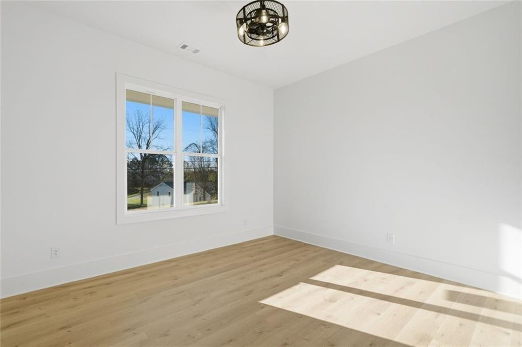 253 Northridge Road Ball Ground, GA 30107 - Photo 11 of 37 a view of an empty room with a window