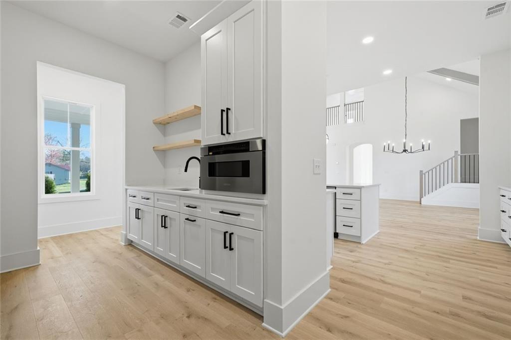 253 Northridge Road Ball Ground, GA 30107 - Photo 21 of 37 a kitchen with stainless steel appliances a white stove top oven and a refrigerator