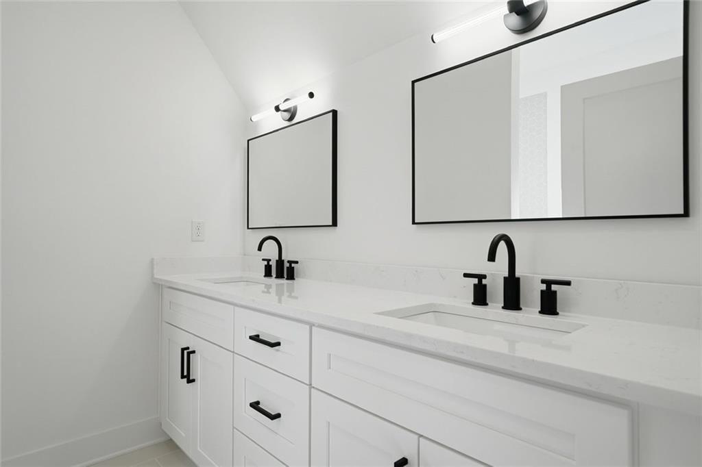 253 Northridge Road Ball Ground, GA 30107 - Photo 26 of 37 a bathroom with a sink and a mirror