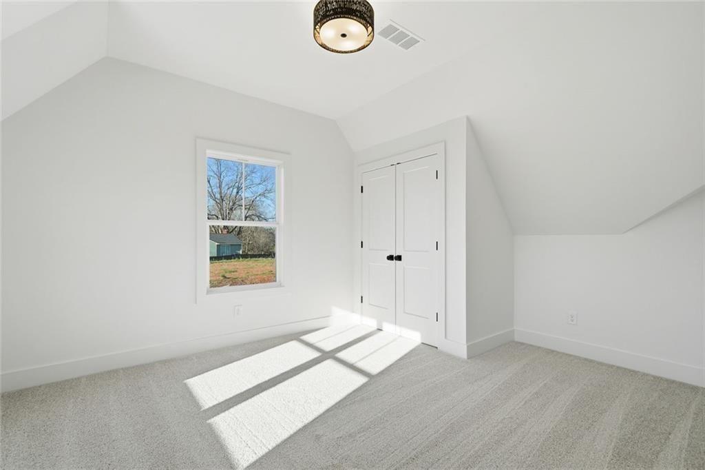 253 Northridge Road Ball Ground, GA 30107 - Photo 28 of 37 an empty room with windows