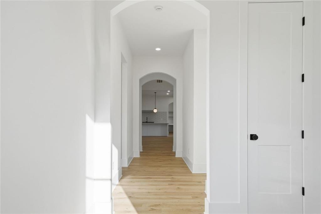 253 Northridge Road Ball Ground, GA 30107 - Photo 3 of 37 a view of a hallway with wooden shelves