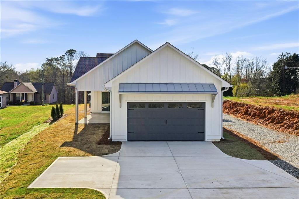 253 Northridge Road Ball Ground, GA 30107 - Photo 31 of 37 a view of a house with a yard