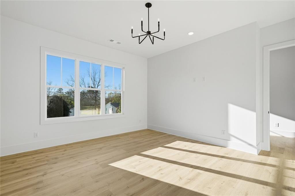 253 Northridge Road Ball Ground, GA 30107 - Photo 5 of 37 a view of an empty room with a window