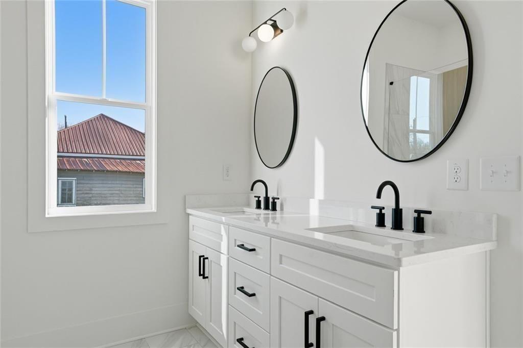 253 Northridge Road Ball Ground, GA 30107 - Photo 7 of 37 a bathroom with a sink and a mirror
