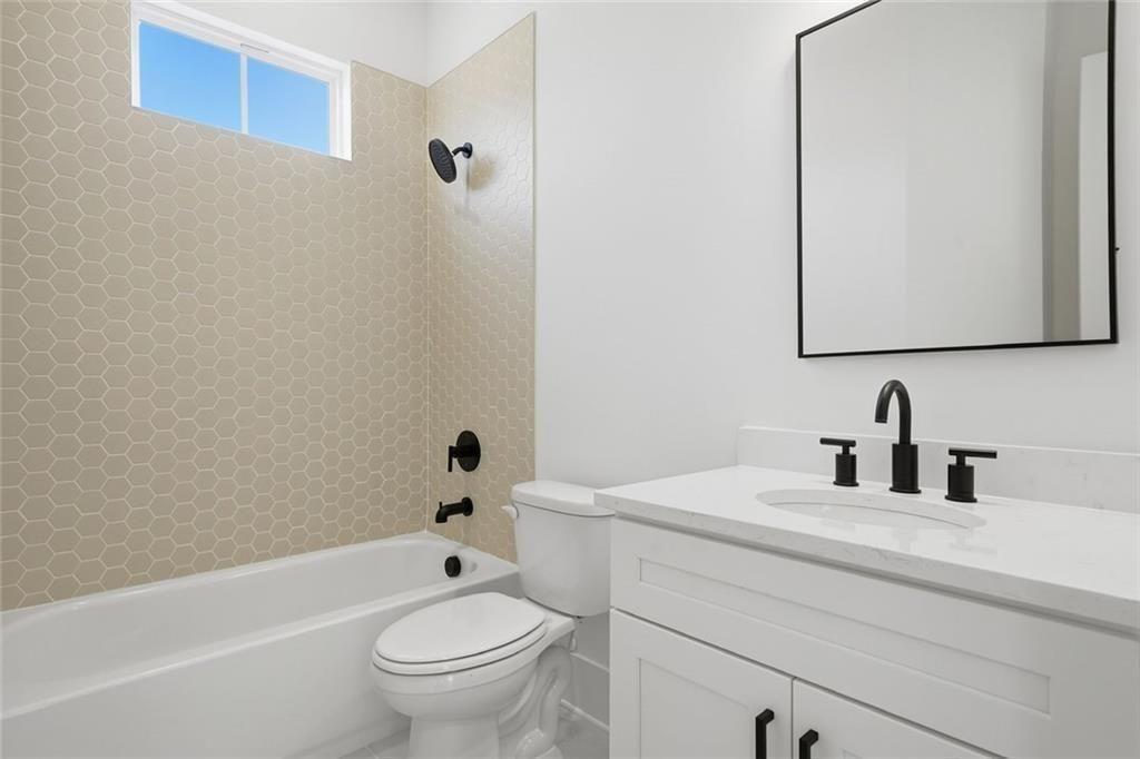 253 Northridge Road Ball Ground, GA 30107 - Photo 10 of 37 a bathroom with a sink a toilet and shower