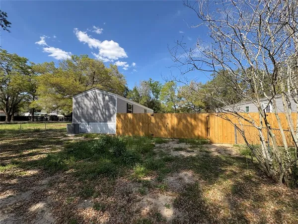 a kitchen with stainless steel appliances a refrigerator and a stove top oven