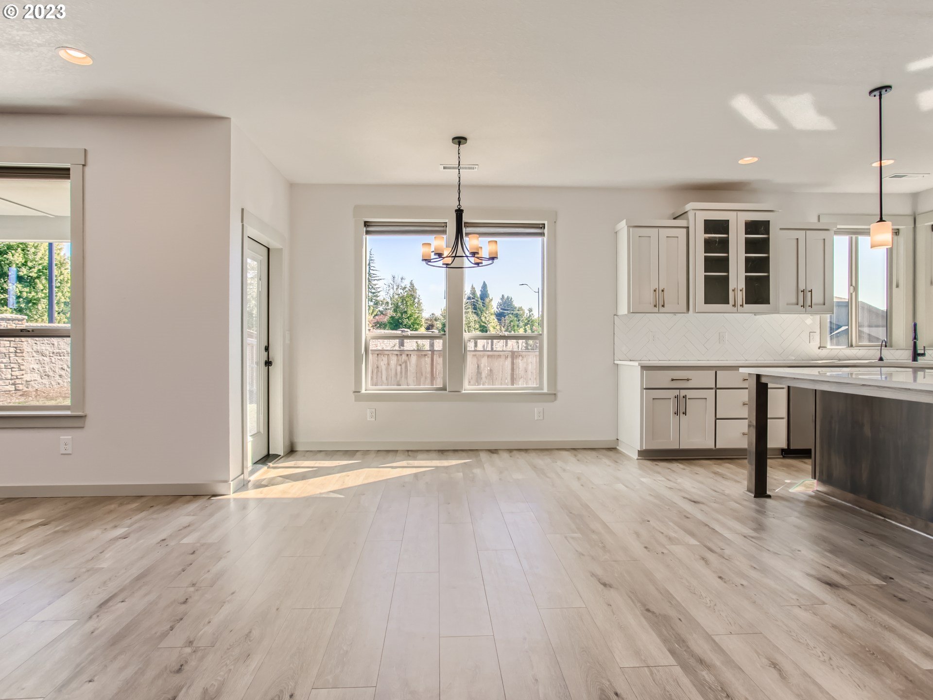 2400 South Eagle Ridge Drive Ridgefield, WA 98642 - Photo 8 of 34 an empty room with wooden floor and windows
