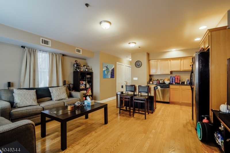 5 Maple Avenue Union, NJ 07088 - Photo 2 of 11 a living room with furniture and a flat screen tv