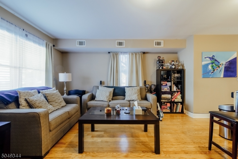 5 Maple Avenue Union, NJ 07088 - Photo 3 of 11 a living room with furniture and a table