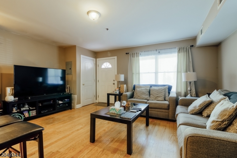 5 Maple Avenue Union, NJ 07088 - Photo 5 of 11 a living room with furniture and a flat screen tv