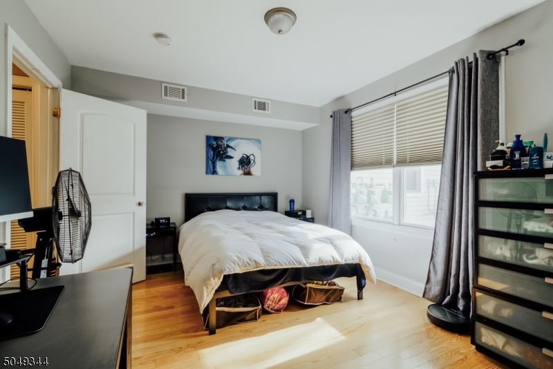 5 Maple Avenue Union, NJ 07088 - Photo 8 of 11 a bedroom with a bed and a window