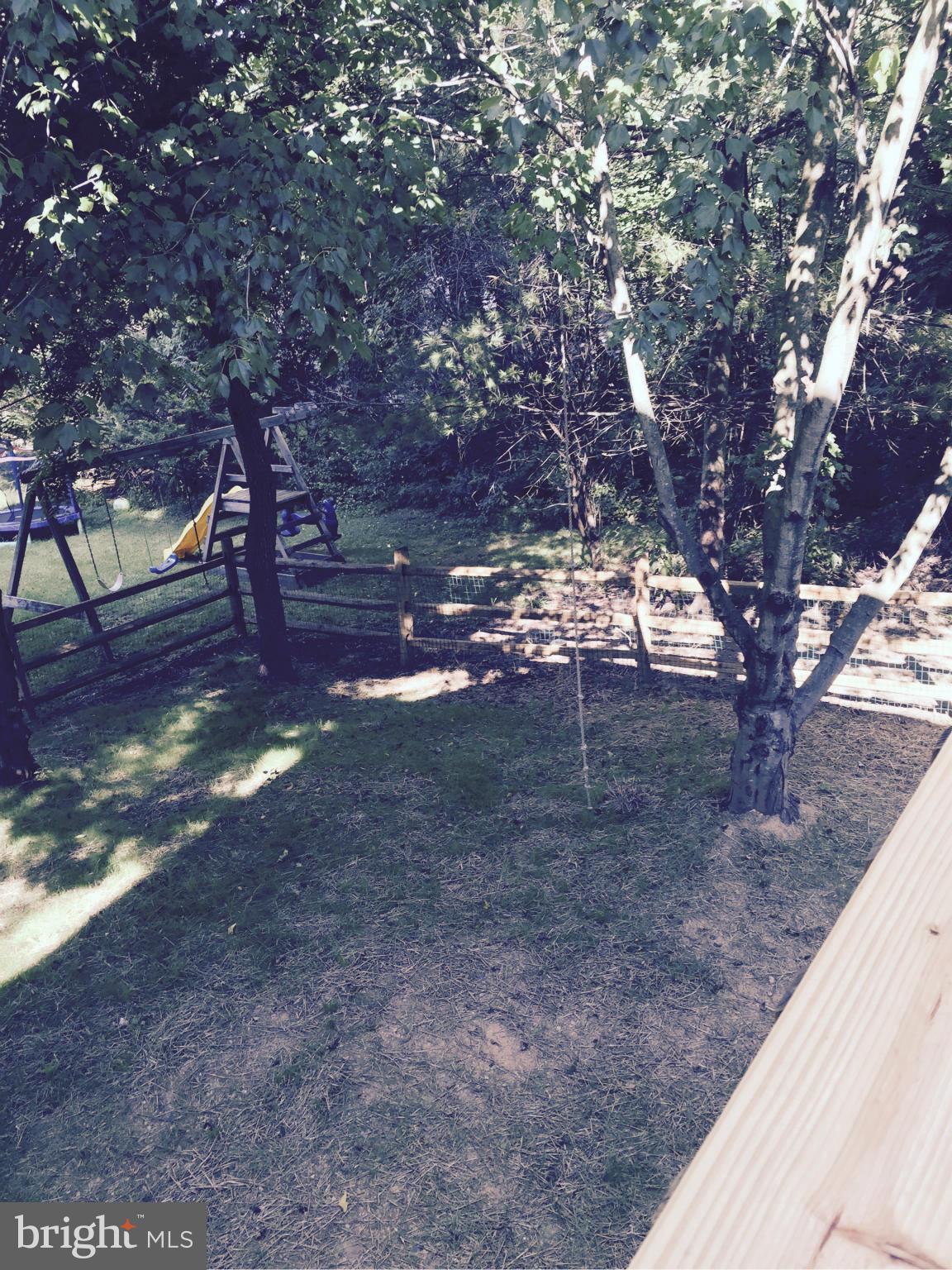 7021 Fox Chase Road New Market, MD 21774 - Photo 23 of 26 View of the level fenced yard from deck