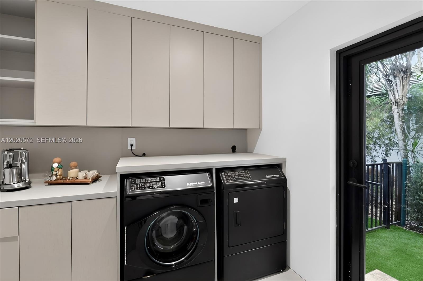 439 Hardee Road Coral Gables, FL 33146 - Photo 31 of 35 a utility room with sink dryer and washer