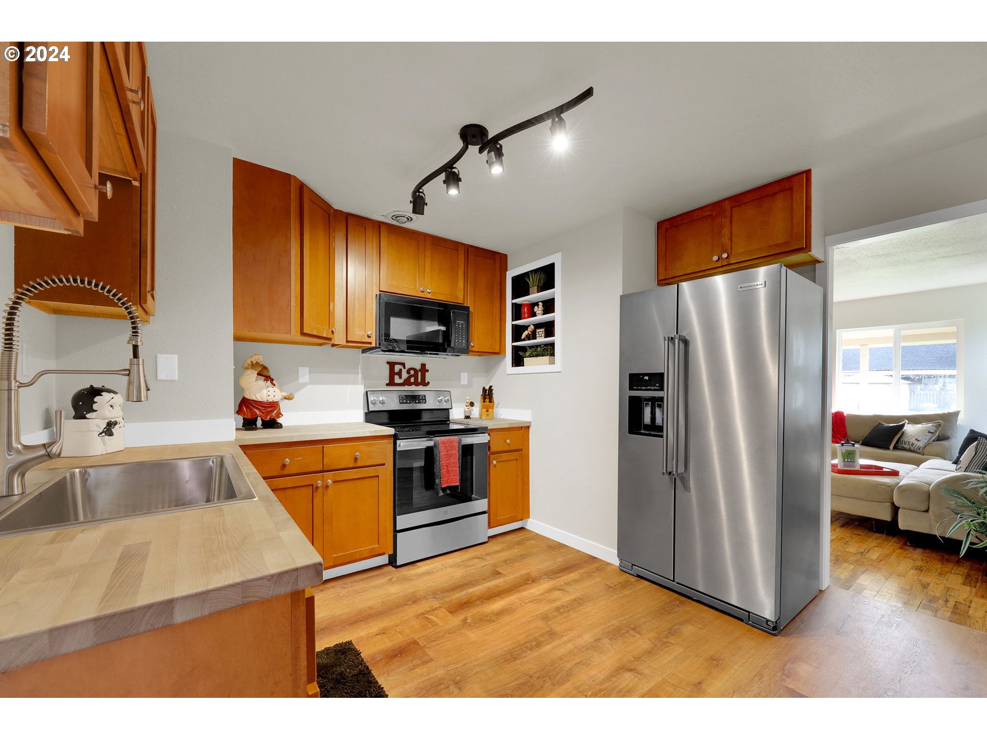 1248 M Street Springfield, OR 97477 - Photo 11 of 44 a kitchen with stainless steel appliances granite countertop a refrigerator stove and sink
