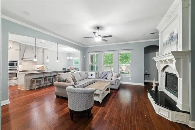 a living room with furniture fireplace and flat screen tv