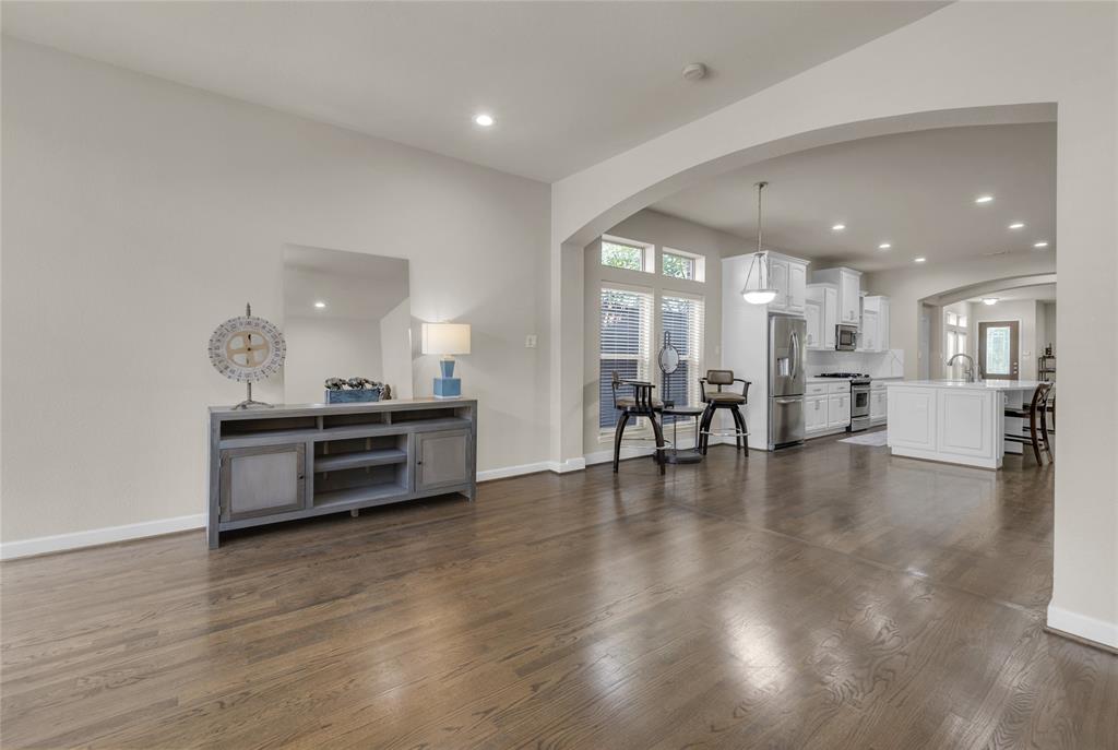 2407 Knight Street Dallas, TX 75219 - Photo 11 of 24 a open kitchen with stainless steel appliances a large counter top a stove and a refrigerator