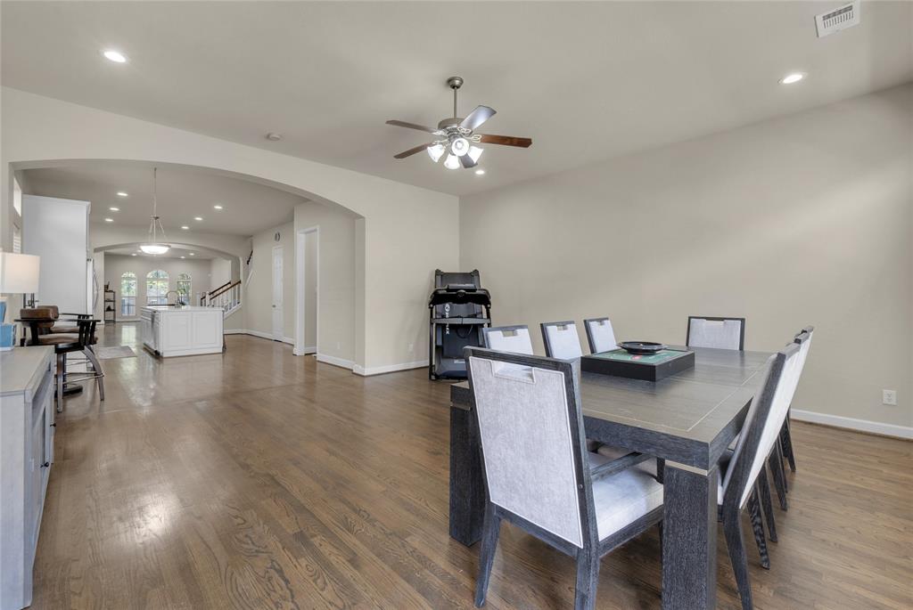 2407 Knight Street Dallas, TX 75219 - Photo 12 of 24 a view of a dining room with furniture and wooden floor
