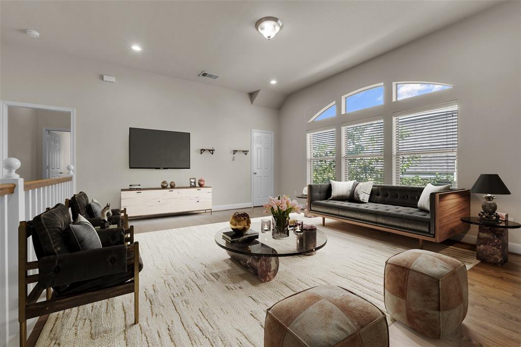 2407 Knight Street Dallas, TX 75219 - Photo 20 of 24 a living room with furniture and a flat screen tv